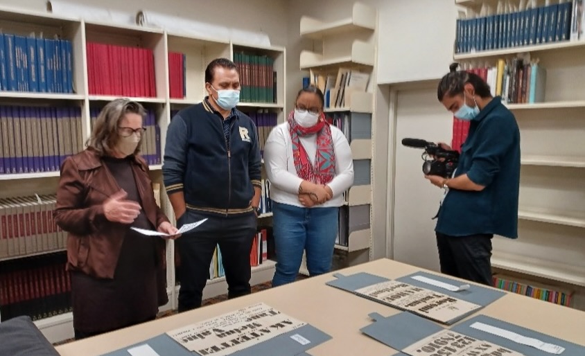 Jane Wild, Matara Tuaputa, Angelique Tuaputa and Benjamin Brooking, during filming for The Pepe Trail – Printing in Rarotonga, 2021, Auckland Central Library Heritage Collections Reading Room, photograph by Sue Berman